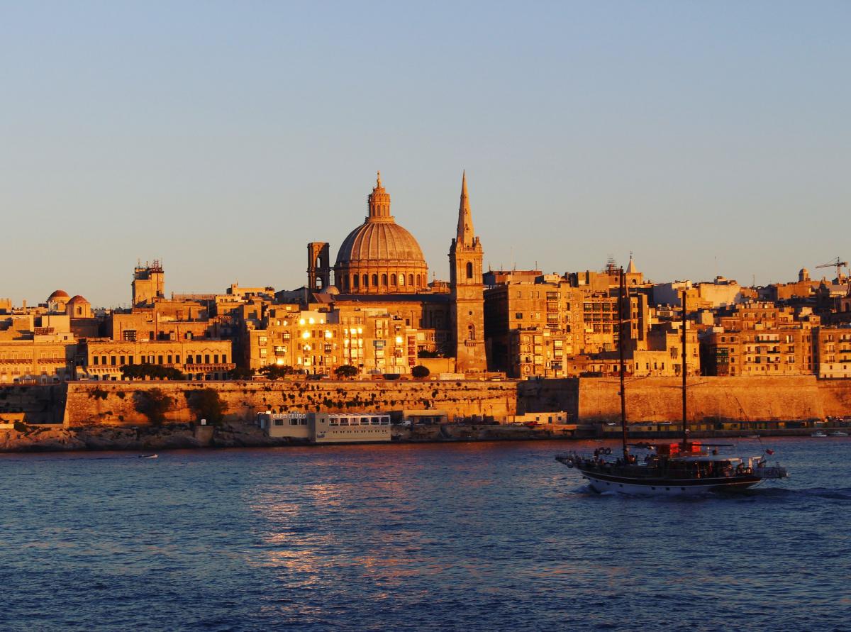 $Guide to obtaining Malta Residence on table
